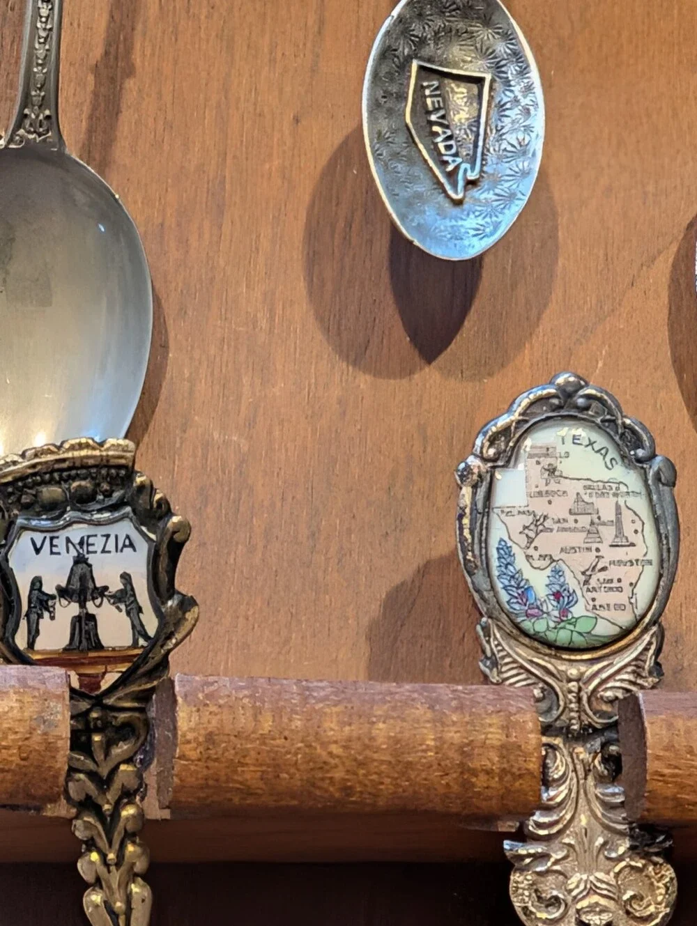Vintage Decorative Souvenir Spoon Set on Wooden Display